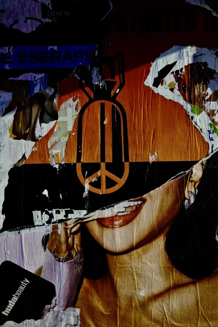 Layers of ripped, wheat-pasted posters in Los Angeles.